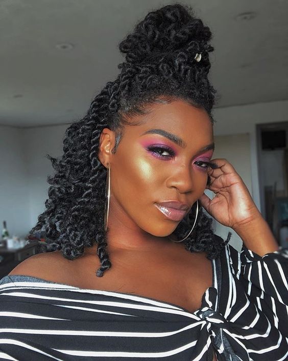 This medium Senegalese twist updo is perfect for date night. (Especially when your makeup is POPPIN' like hers is),