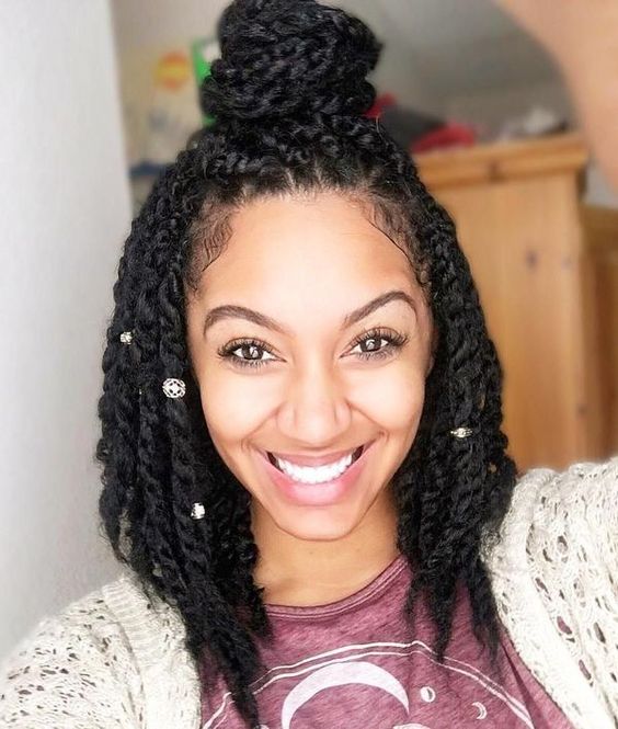 These almost look like a hybrid mix between short Senegalese twist crochet hair and kinky twists, either way a professional natural hair salon will be able to give you this twisted style.