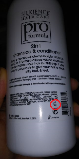 a shampoo bottle with the shelf life circled in red how-to-read-shampoo-expiration-dates-12m