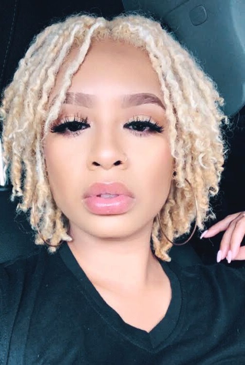 Cute blonde sisterlocks on pretty black woman. sisterlocs.  Nike, good hair.