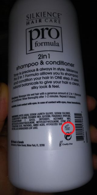 a shampoo bottle with the shelf life circled in red how-to-read-shampoo-expiration-dates-12m